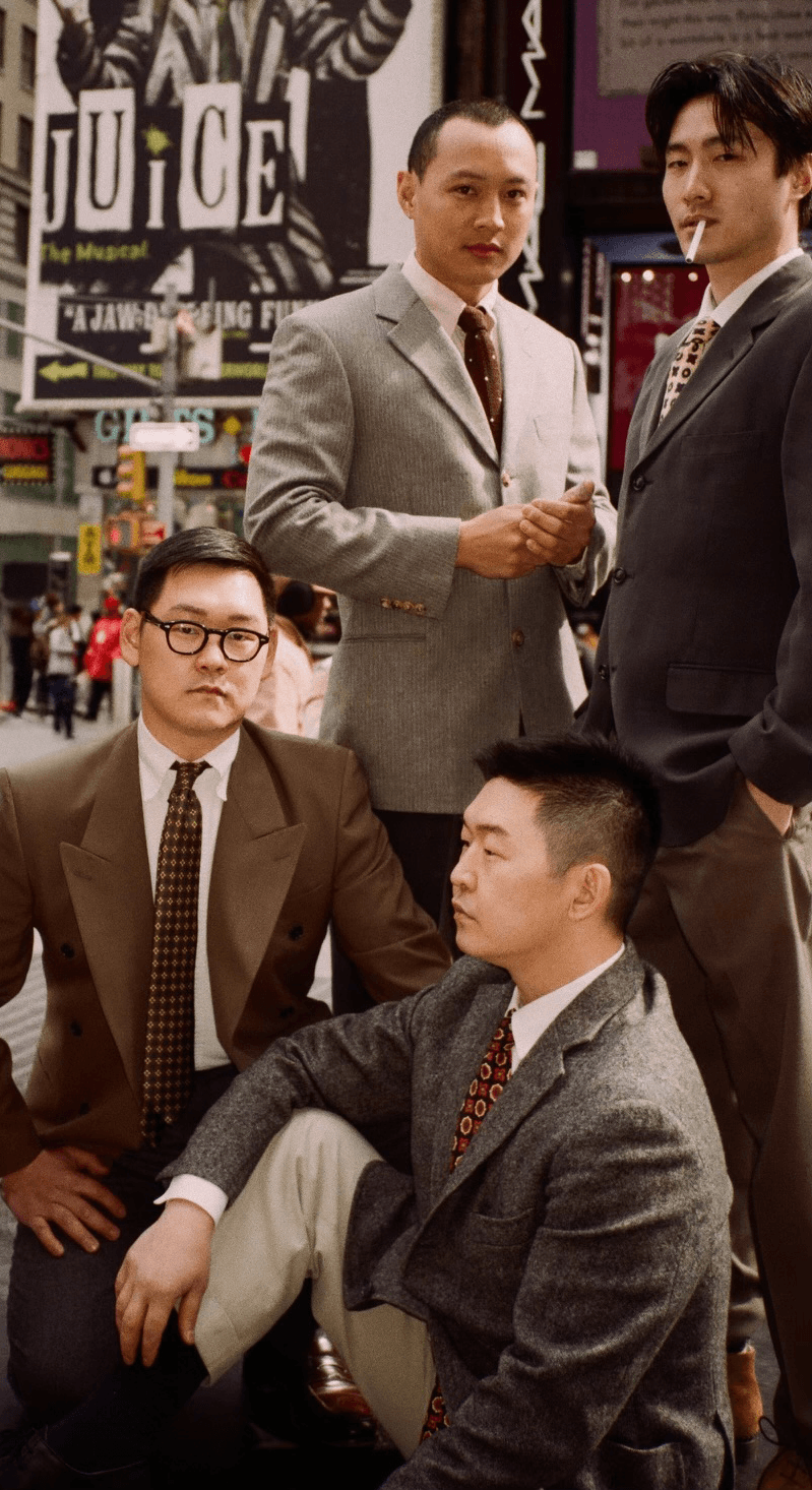 Four men in Lightkeeper tailoring photographed on a New York City street